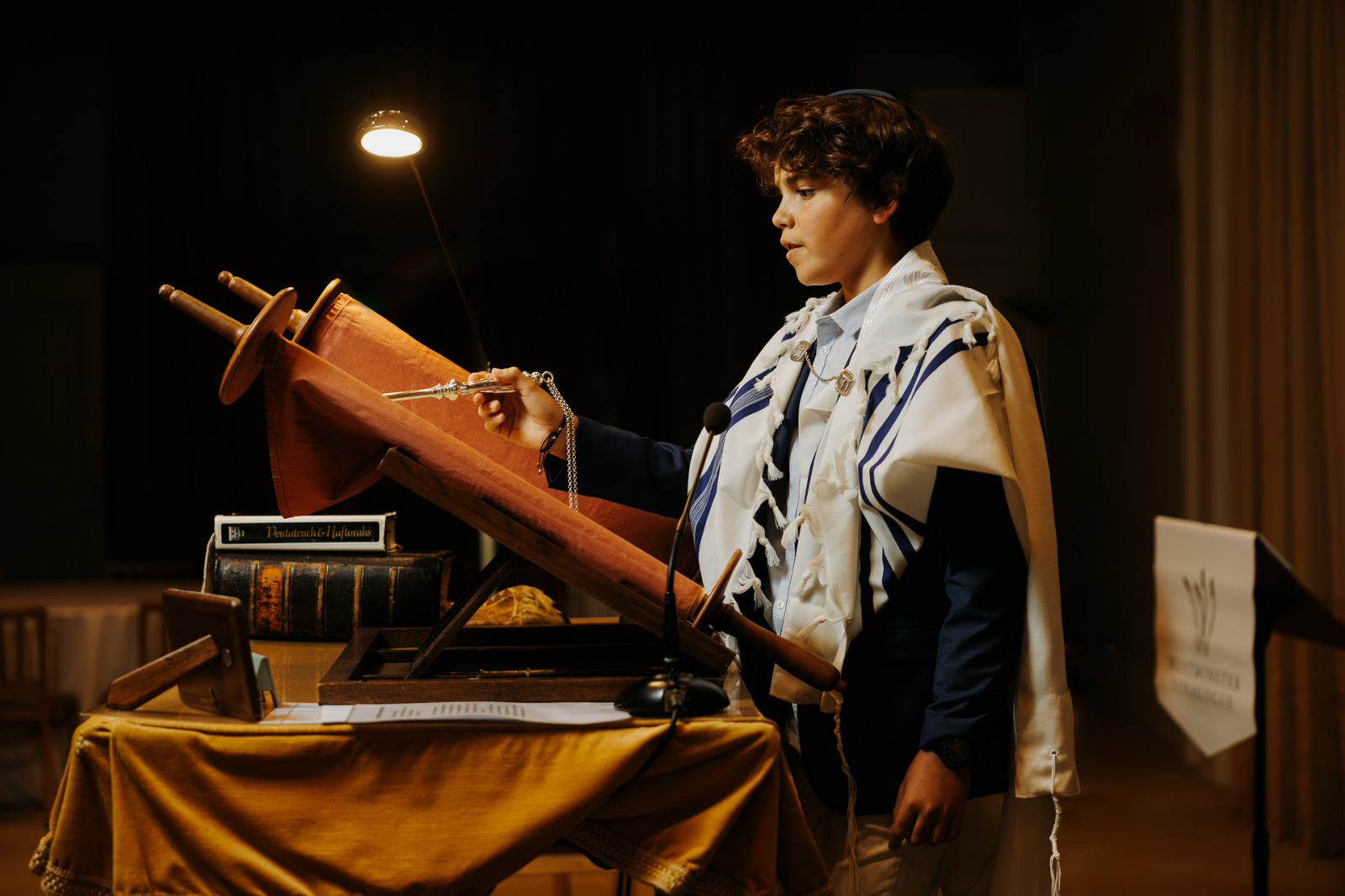 Bar Mitzvah boy reading from the Torah