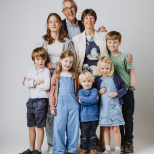 Photo of a family with grandparents and grandchildren in a photo studio